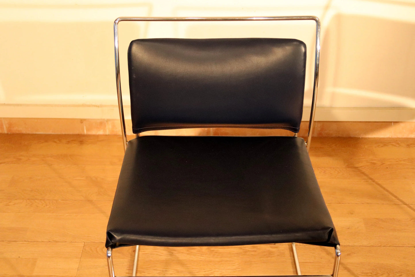 Pair of Tulu chairs by Kazuhide Takahama for Simon Gavina, 1970s, with black leather seat and back and chrome frame.