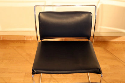 Pair of Tulu chairs by Kazuhide Takahama for Simon Gavina, 1970s, with black leather seat and back and chrome frame.