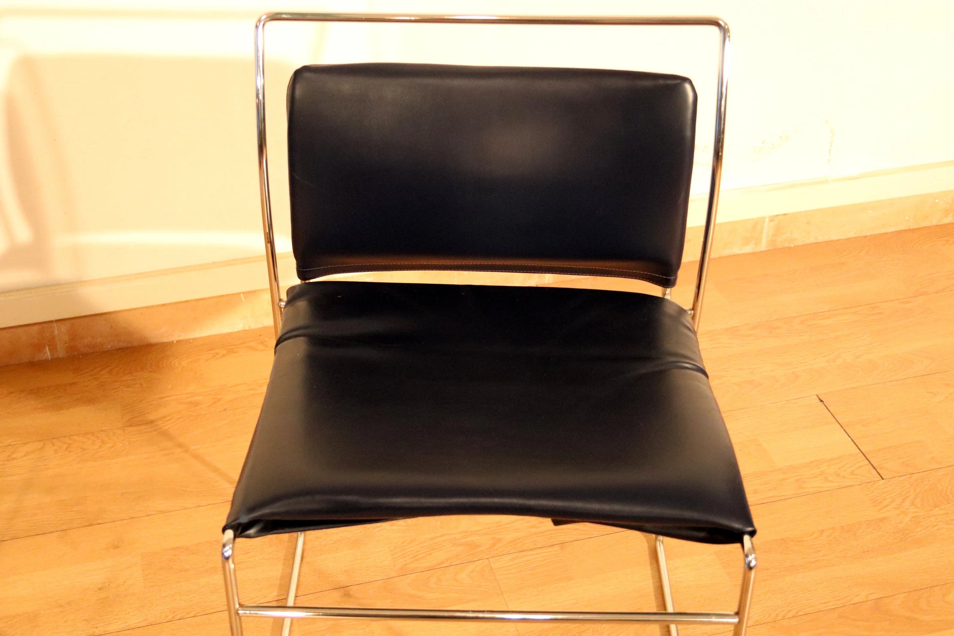 Pair of Tulu chairs by Kazuhide Takahama for Simon Gavina, 1970s, with black leather seat and back and chrome frame.