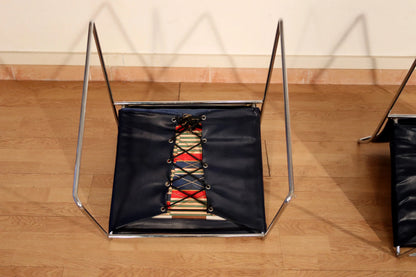 Pair of Tulu chairs by Kazuhide Takahama for Simon Gavina with black leather seat and colored laces from the 1970s.