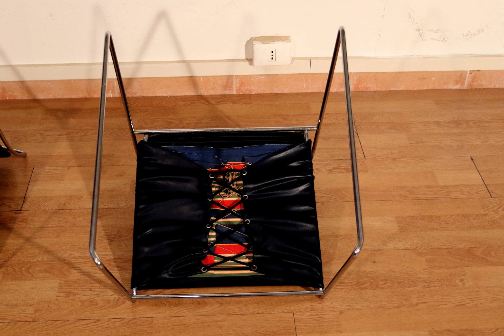 Pair of Tulu chairs by Kazuhide Takahama for Simon Gavina, 1970s, with black leather seat, chrome frame and red finish.
