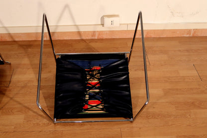 Pair of Tulu chairs by Kazuhide Takahama for Simon Gavina, 1970s, with black leather seat, chrome frame and red finish.