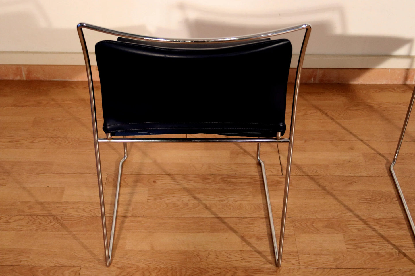 Pair of Tulu chairs by Kazuhide Takahama for Simon Gavina with black leather seat and chromed metal frame, 1970s
