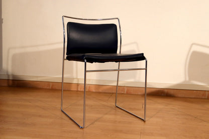 Pair of Tulu chairs by Kazuhide Takahama for Simon Gavina, 1970s, with black leather seat and backrest and chromed metal frame.