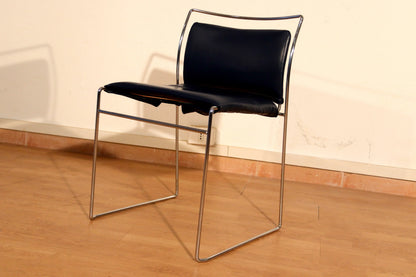 A pair of Tulu chairs by Kazuhide Takahama for Simon Gavina with black leather seats and elegant chrome frames.