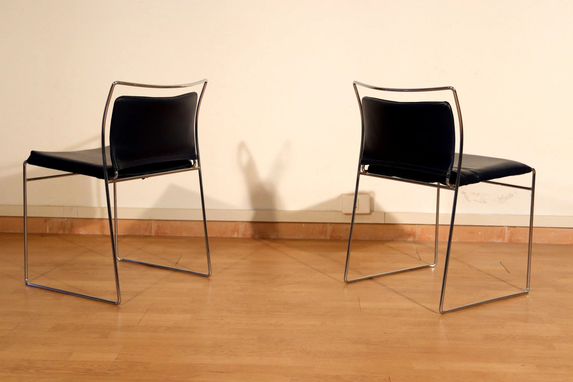 Pair of Tulu chairs by Kazuhide Takahama for Simon Gavina, 1970s, with black leather seats and elegant chrome frame.