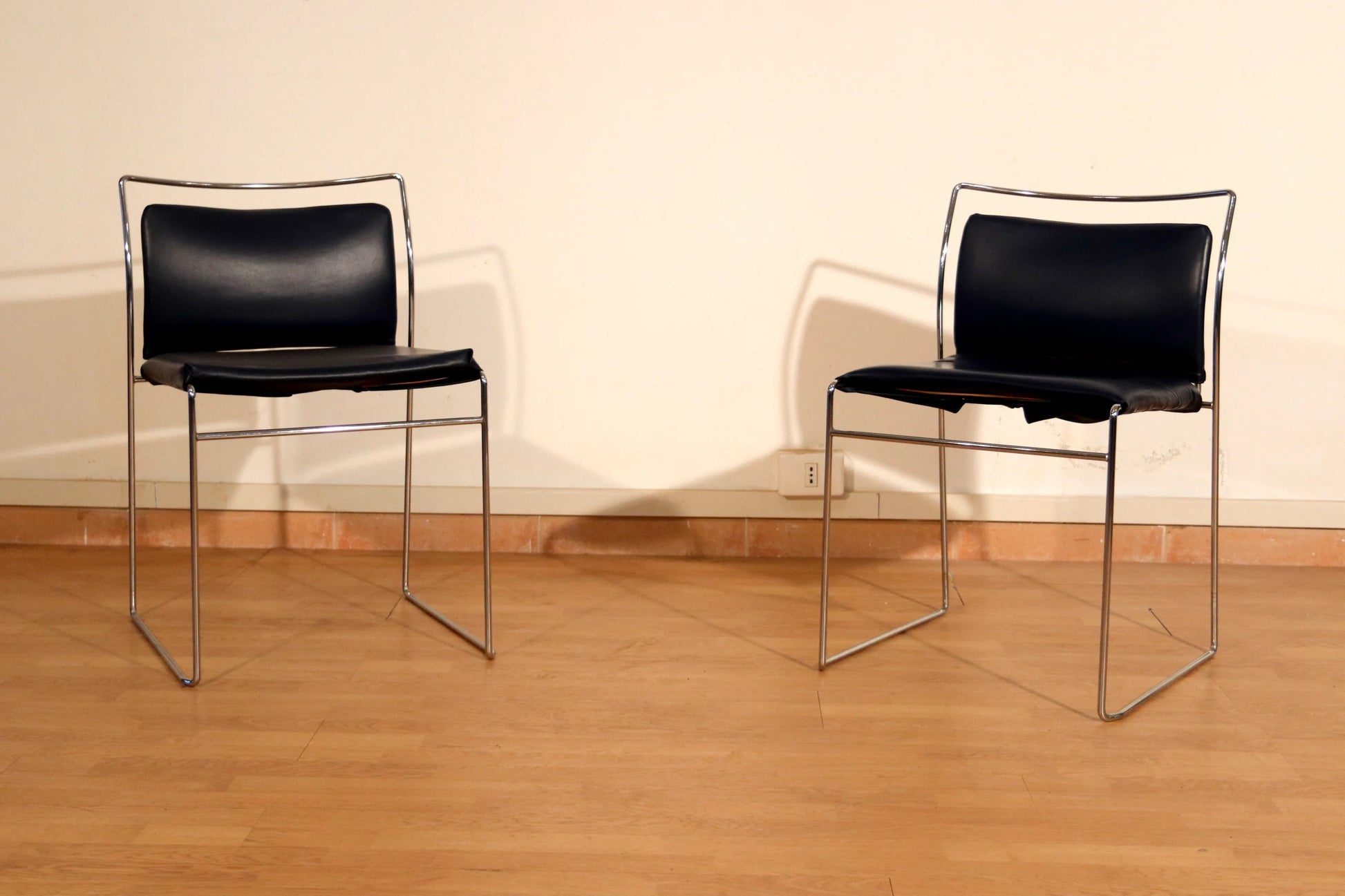 Pair of Tulu chairs by Kazuhide Takahama for Simon Gavina with black leather seats and chromed metal frame, 1970s
