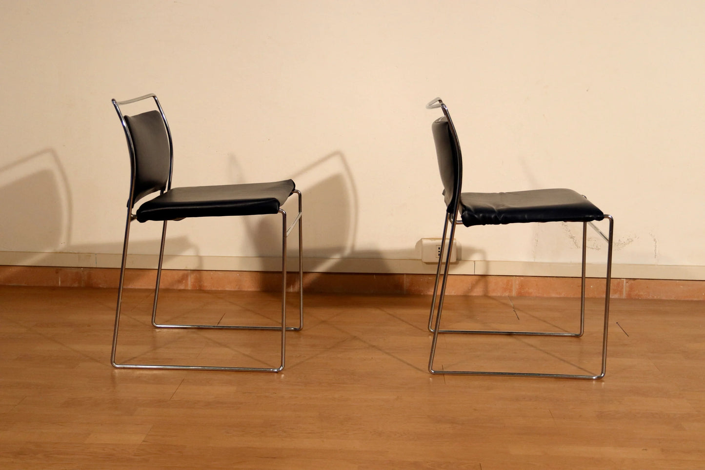 Pair of Tulu chairs by Kazuhide Takahama for Simon Gavina, 1970s, in black leather and chromed metal frame.
