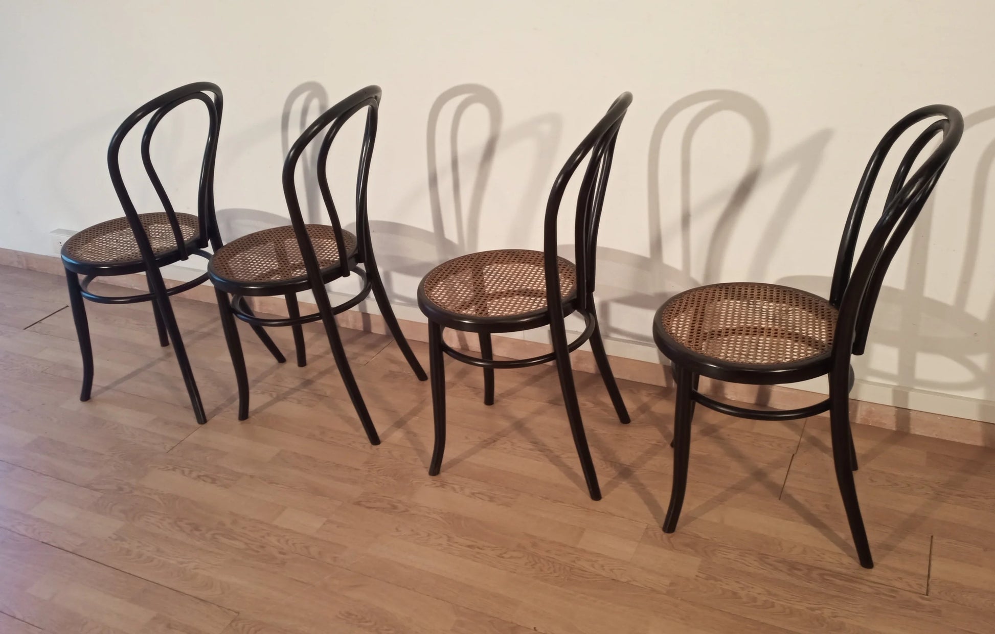 Set of 4 Thonet Italia style bentwood dining chairs with cane seat in light wood color