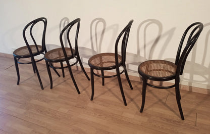 Set of 4 Thonet Italia style bentwood dining chairs with cane seat in light wood color