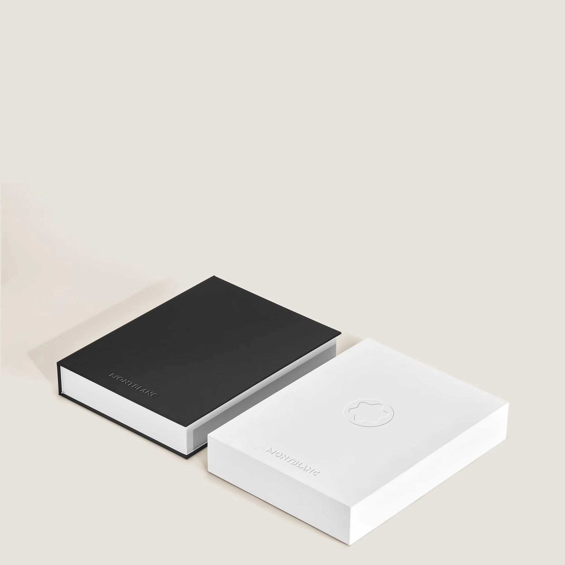 Two minimalist Montblanc Digital Paper Silver 135012 presentation boxes in black and white with embossed logo