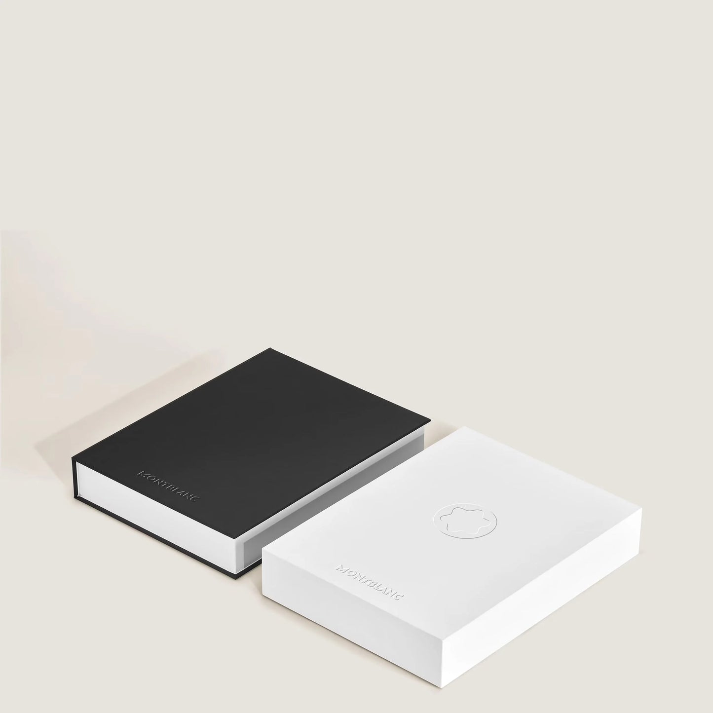 Two minimalist Montblanc digital paper black 135010 with black and white slipcases and engraved logo